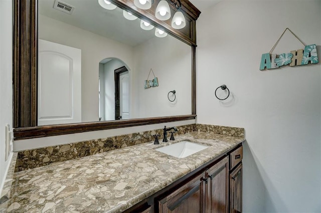 bathroom featuring vanity and visible vents