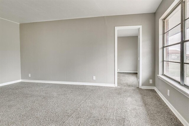 416 NW 81st St, Oklahoma City, OK 73114 - unfurnished room featuring baseboards and carpet
