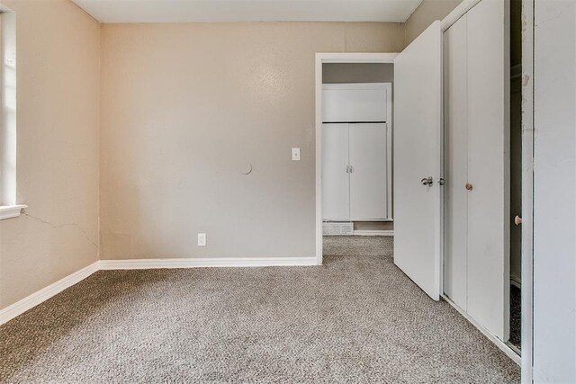 416 NW 81st St, Oklahoma City, OK 73114 - unfurnished bedroom with a closet, carpet, and baseboards