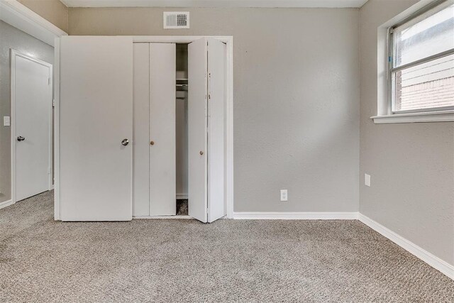 416 NW 81st St, Oklahoma City, OK 73114 - unfurnished bedroom featuring visible vents, baseboards, a closet, and carpet floors
