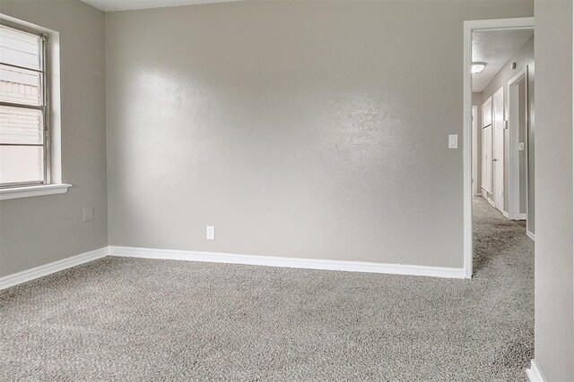 416 NW 81st St, Oklahoma City, OK 73114 - spare room with baseboards and carpet