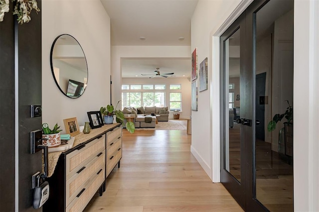 hallway featuring light wood-style floors