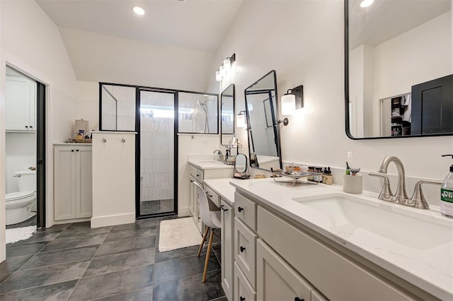 full bathroom with a stall shower, recessed lighting, vaulted ceiling, and vanity