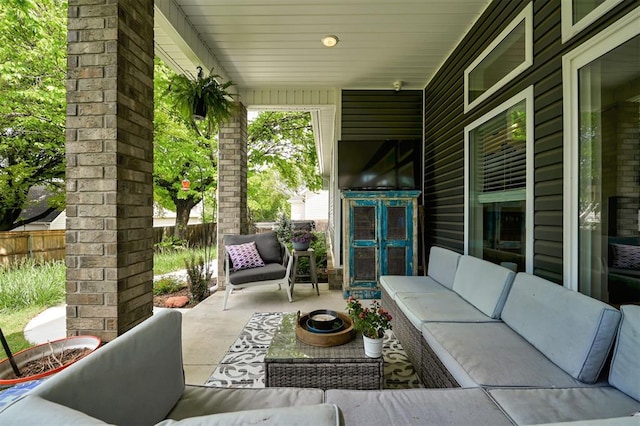 view of patio / terrace with fence and an outdoor hangout area