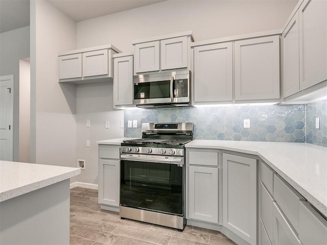 1680 Addington Rd, Newcastle, OK 73065 - kitchen with baseboards, decorative backsplash, light stone counters, and appliances with stainless steel finishes