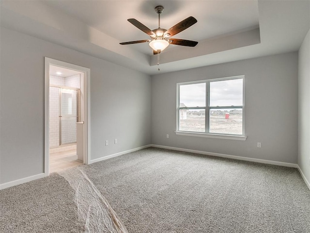 1680 Addington Rd, Newcastle, OK 73065 - spare room with carpet, baseboards, a ceiling fan, and a raised ceiling