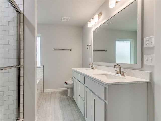 1680 Addington Rd, Newcastle, OK 73065 - bathroom with double vanity, visible vents, a sink, and toilet
