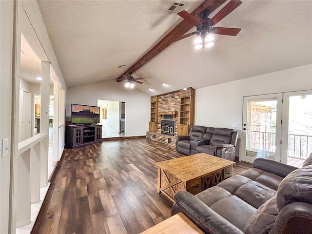 1016 Canyon Ridge Rd, Clinton, OK 73601 - living room with dark wood-style flooring, lofted ceiling with beams, a ceiling fan, visible vents, and a textured ceiling