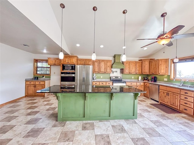 1016 Canyon Ridge Rd, Clinton, OK 73601 - kitchen with a sink, stainless steel appliances, a wealth of natural light, wall chimney exhaust hood, and lofted ceiling