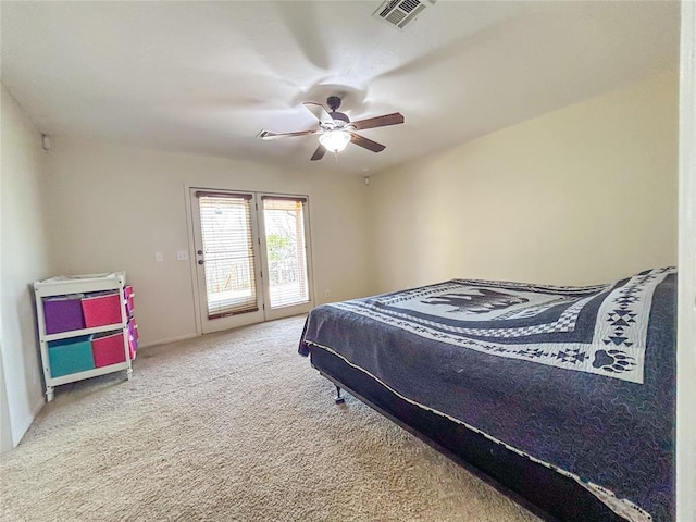 1016 Canyon Ridge Rd, Clinton, OK 73601 - bedroom featuring visible vents, access to outside, ceiling fan, and carpet