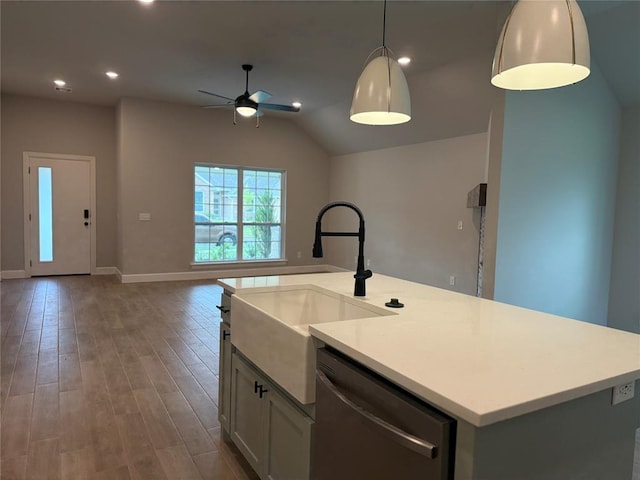 1220 SW 139th St, Oklahoma City, OK 73170 - kitchen with stainless steel dishwasher, a ceiling fan, open floor plan, wood finished floors, and light countertops