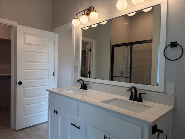 1220 SW 139th St, Oklahoma City, OK 73170 - bathroom with double vanity, a tile shower, and a spacious closet