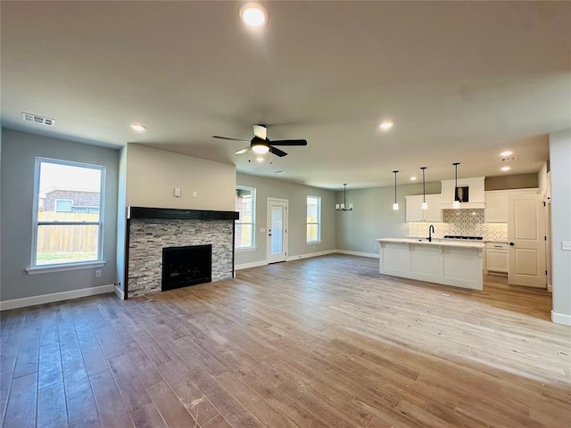 1221 SW 141st St, Oklahoma City, OK 73170 - unfurnished living room with baseboards, ceiling fan, a sink, and recessed lighting