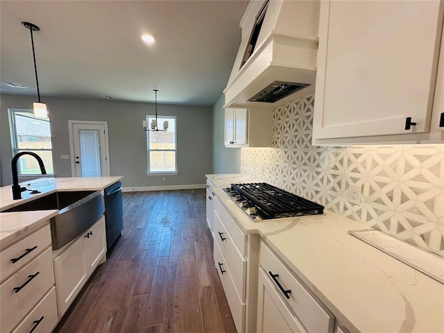 1221 SW 141st St, Oklahoma City, OK 73170 - kitchen with stainless steel gas cooktop, a sink, premium range hood, dishwasher, and white cabinetry