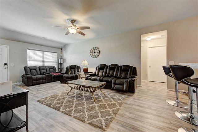1641 Tumbleweed Way, El Reno, OK 73036 - living area with light wood-style floors, baseboards, and a ceiling fan
