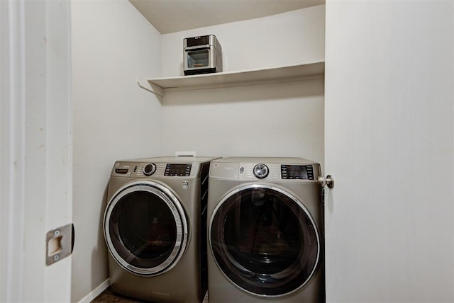1641 Tumbleweed Way, El Reno, OK 73036 - laundry area with laundry area, washer and clothes dryer, and baseboards