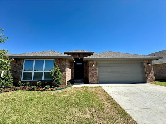 8605 NW 76th St, Oklahoma City, OK 73132 - view of front of house with a garage, driveway, a front lawn, and brick siding