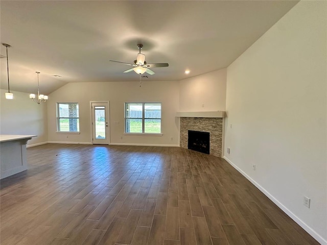 8605 NW 76th St, Oklahoma City, OK 73132 - unfurnished living room with baseboards, ceiling fan, dark wood-type flooring, and vaulted ceiling