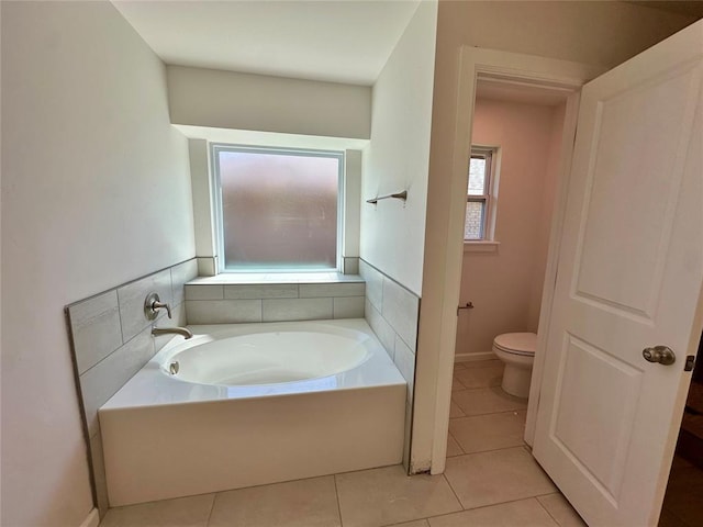 8605 NW 76th St, Oklahoma City, OK 73132 - full bath with toilet, a garden tub, and tile patterned floors