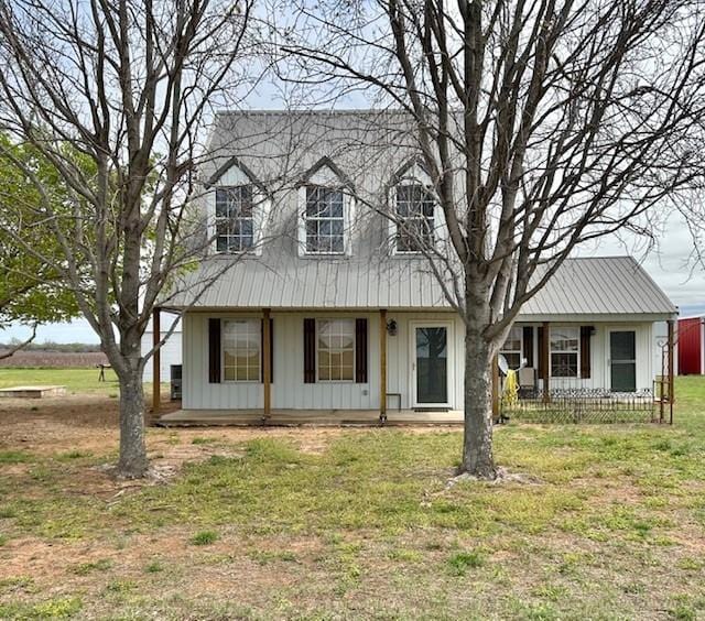713 Whispering Water Dr, Fort Cobb, OK 73038 - new england style home featuring board and batten siding and a front lawn
