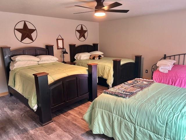 713 Whispering Water Dr, Fort Cobb, OK 73038 - bedroom featuring wood finished floors and ceiling fan