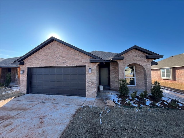 18117 Austin Ct, Edmond, OK 73012 - single story home with concrete driveway, an attached garage, and brick siding