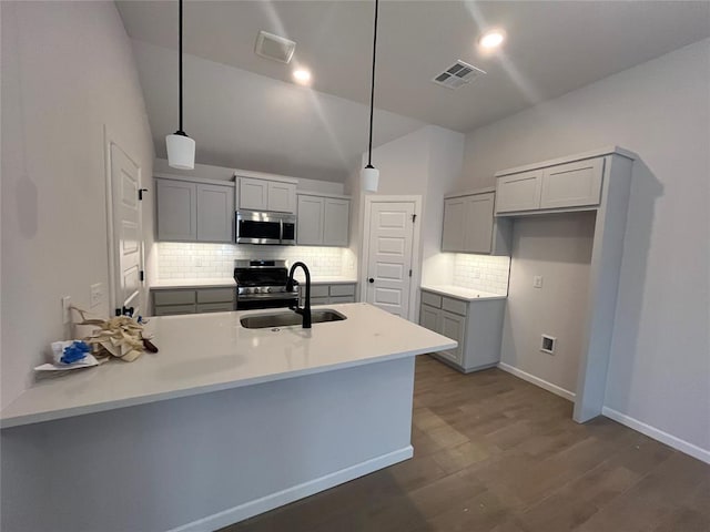18117 Austin Ct, Edmond, OK 73012 - kitchen with a sink, visible vents, stainless steel appliances, a peninsula, and gray cabinets