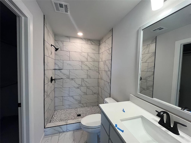 18117 Austin Ct, Edmond, OK 73012 - full bathroom with visible vents, toilet, a tile shower, and marble finish floor