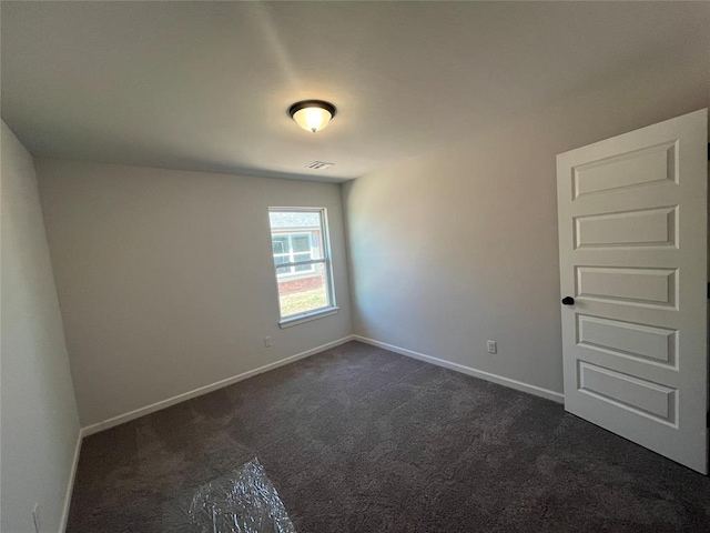 18117 Austin Ct, Edmond, OK 73012 - unfurnished room featuring dark colored carpet, visible vents, and baseboards
