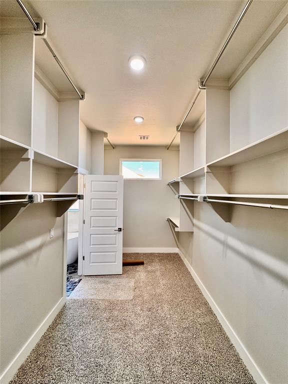 10132 NW 100th St, Yukon, OK 73099 - walk in closet featuring carpet floors