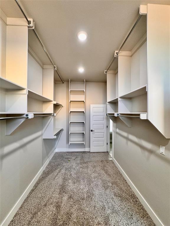 10132 NW 100th St, Yukon, OK 73099 - spacious closet with carpet flooring