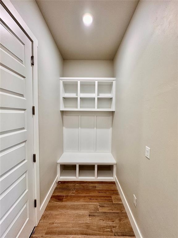 10132 NW 100th St, Yukon, OK 73099 - mudroom featuring wood finished floors and baseboards