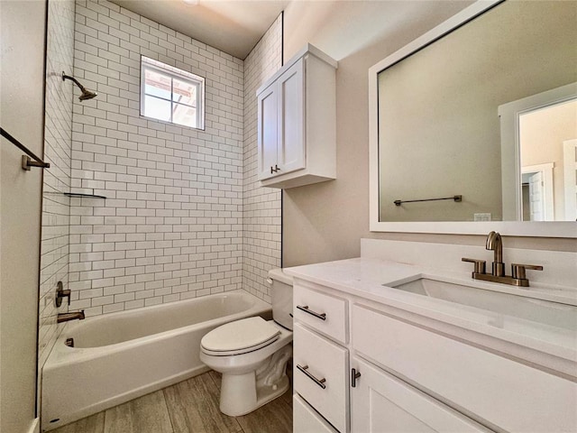 10132 NW 100th St, Yukon, OK 73099 - full bath with vanity, wood finished floors, and washtub / shower combination