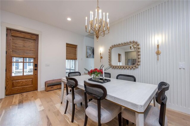 dining area featuring baseboards, an inviting chandelier, light wood-style floors, and recessed lighting