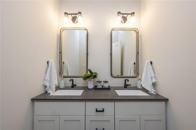 full bath with a sink and double vanity