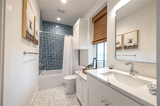 bathroom with recessed lighting, visible vents, toilet, vanity, and shower / tub combo