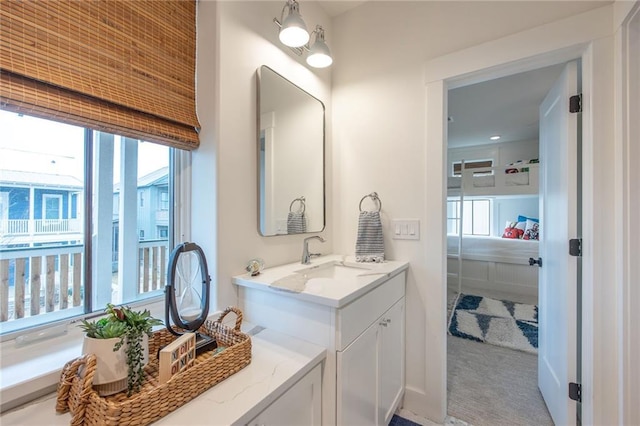 bathroom featuring plenty of natural light and vanity