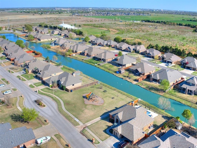 birds eye view of property featuring a residential view and a water view