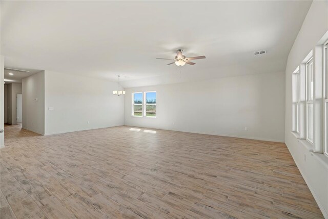 4605 Lincoln Lndg, Harrah, OK 73045 - spare room featuring ceiling fan, a chandelier, light wood-style flooring, and baseboards