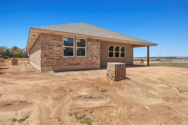 4605 Lincoln Lndg, Harrah, OK 73045 - back of house with roof with shingles