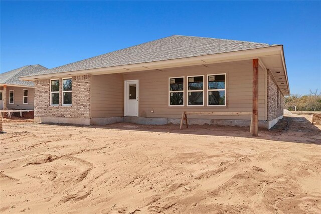 4605 Lincoln Lndg, Harrah, OK 73045 - rear view of property with roof with shingles