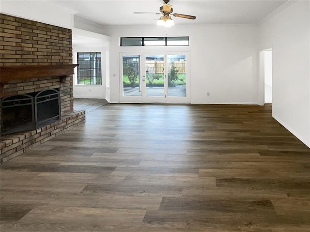3708 Teresa Dr, Moore, OK 73160 - unfurnished living room with a ceiling fan, wood finished floors, ornamental molding, and a brick fireplace