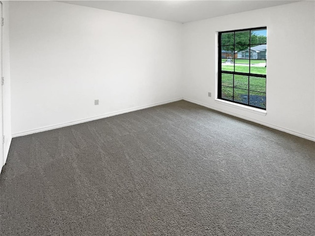 3708 Teresa Dr, Moore, OK 73160 - spare room featuring dark colored carpet and baseboards