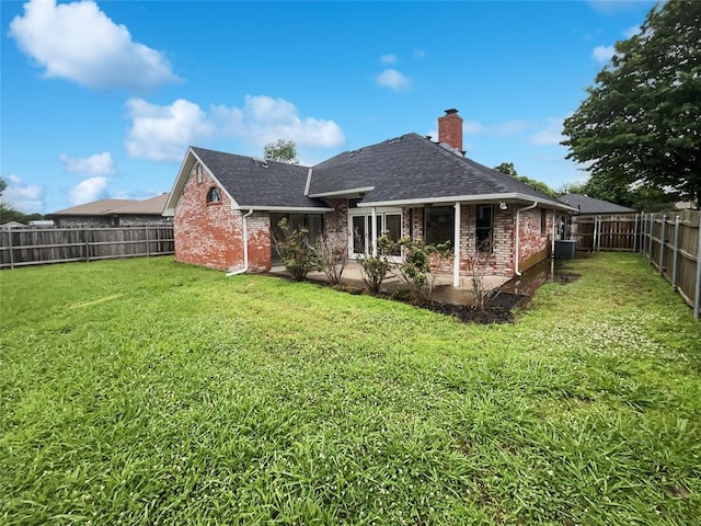 3708 Teresa Dr, Moore, OK 73160 - rear view of house with brick siding, a chimney, roof with shingles, and a fenced backyard