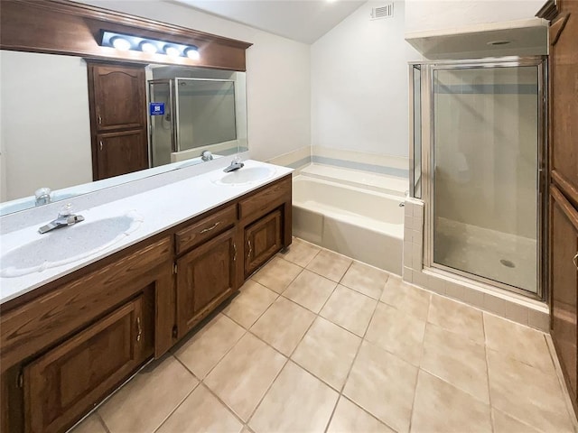 3708 Teresa Dr, Moore, OK 73160 - full bath featuring a bath, a shower stall, tile patterned flooring, double vanity, and lofted ceiling
