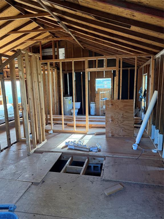1709 Fisherman Rd, Carnegie, OK 73015 - misc room with plenty of natural light and vaulted ceiling