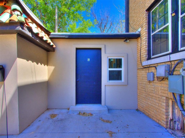 225 NW 24th St, Oklahoma City, OK 73103 - view of exterior entry featuring stucco siding