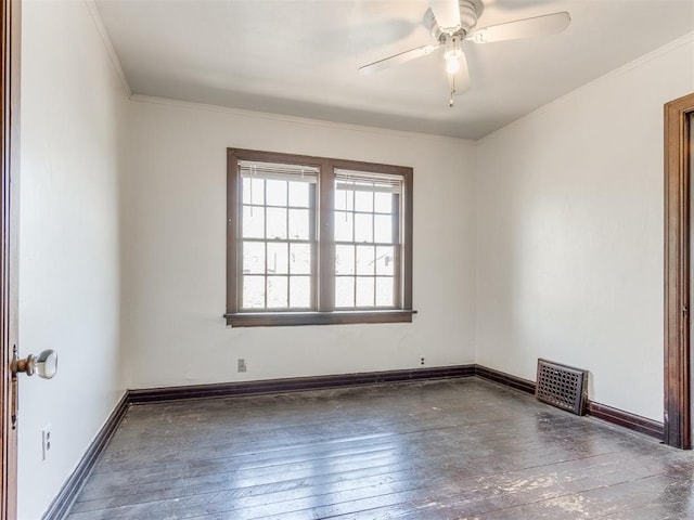 225 NW 24th St, Oklahoma City, OK 73103 - unfurnished room with ornamental molding, visible vents, a ceiling fan, wood-type flooring, and baseboards