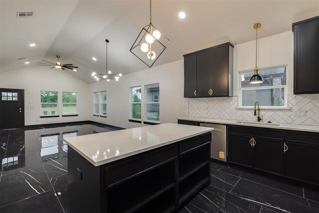 528 NW 112th St, Oklahoma City, OK 73114 - kitchen featuring a sink, stainless steel dishwasher, dark marble finish floors, dark cabinets, and vaulted ceiling