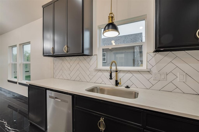 528 NW 112th St, Oklahoma City, OK 73114 - kitchen featuring dishwasher, a sink, dark cabinetry, and decorative backsplash